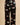 Close-up of the Olivia von Halle Lila Rene Black Blossom silk pajama pants featuring the exclusive Blossom floral print on black 19 momme silk satin.