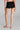 Model wearing Oscalito Silk Middle Rise Panties with Leavers Lace in black showing seamless fit and soft rib texture