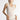Model wearing Oscalito wool and silk lace tank top in ivory showing lace neckline.