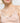 Model wearing Oscalito wool and silk V-neck camisole in beige with satin trim showing neckline and fit