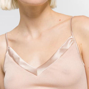 Model wearing Oscalito wool and silk V-neck camisole in beige with satin trim showing neckline and fit