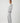 Side view of the Pluto Alena knitted pajama set with a relaxed V neck top and wide leg cotton modal pants.
