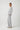 Side view of the Pluto Alena knitted pajama set with a relaxed V neck top and wide leg cotton modal pants.