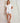 Pluto Celana short cotton pajama set with short-sleeve top and lace-trimmed shorts in crisp white.