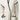 Beige knitted robe with black trim at collar, sleeve, and pocket