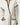 Beige knitted robe with black trim at collar, sleeve, and pocket