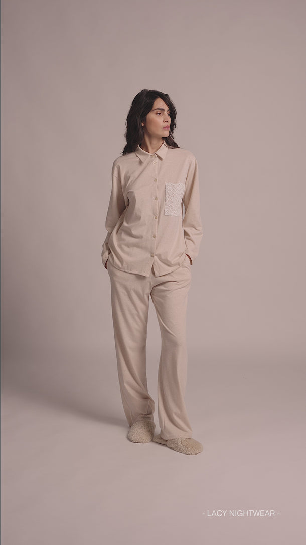 Video of Model wearing Pluto Egonda Cotton Pajama Set showing button-down top, lace pocket, and full-length pants