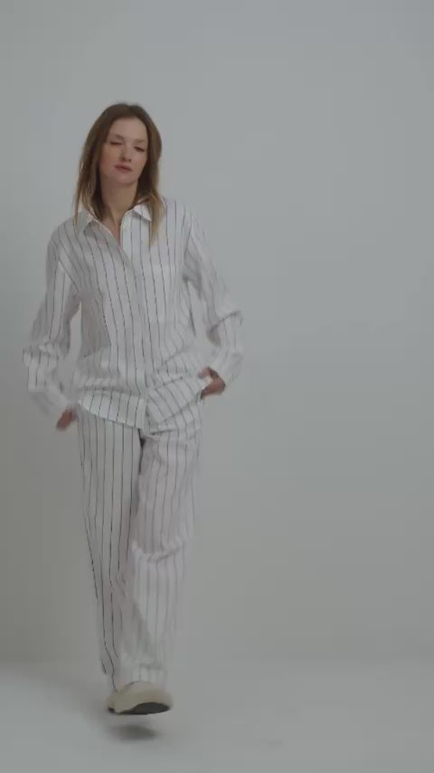 Mode;l wearing Hazel Long Pajama Set in blue stripes
