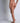 Sheer beige tanga brief with gold charm, embroidered front tulle, and soft fabric back for zero VPL and modern, sexy comfort.