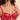 Model wearing the Simone Pérèle Intrigue sheer embroidered demi cup bra in opera red with floral embroidery, unlined tulle cups, and underwire support.