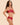 Model wearing the Simone Pérèle Intrigue sheer embroidered demi cup bra in opera red with floral embroidery, unlined tulle cups, and underwire support.