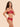 Model wearing the Simone Pérèle Intrigue sheer embroidered demi cup bra in opera red with floral embroidery, unlined tulle cups, and underwire support.