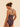 Back view of midnight blue sheer tulle bodysuit with criss-cross adjustable straps