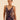 Midnight blue embroidered tulle bodysuit with deep plunge, bow details, and sheer tulle bottom