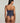 Lace V-string with minimal coverage and delicate embroidery, designed for a seductive, seamless silhouette and lightweight comfort.