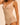  close-up of the Subtile forming body in nude by Simone Pérèle fabric showing smooth shaping material and lace texture