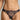 Model wearing the Swarovski Crystals Thong by I.D. Sarrieri in Deep Bleumarine with embroidered lace and crystal detailing