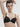 French moulded black t-shirt bra with seamless contour cups, plunge neckline, and multi-way straps in soft microfiber for invisible support.