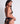 Back view of the Aubade Mini Coeur Cheeky Love black lace brief featuring a satin bow and open back design.