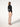 Back view of model wearing Wolford Colorado String Body in black showing seamless thong cut and sleek fit