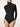 Model wearing Wolford Colorado String Body in black showing roll-neck and smooth exterior finish