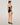 Back view of black forming bodysuit showing adjustable strap closure and seat coverage