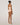Back view of rose tan forming bodysuit showing adjustable strap closure and seat coverage