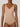 Close-up of rose tan forming bodysuit showing molded bust and V-neckline