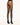 Back view of model wearing Wolford Individual 10 Back Seam Tights in black showing classic back seam and waistband logo