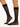 Model wearing Wolford Individual 10 Knee-Highs in black showing matte sheer finish and comfort band
