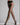 Model wearing Wolford Individual 20 Tights in black showing sheer matte finish and soft waistband