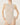 Wolford Infinite Rose Net String Body in cream, featuring a seamless sleeveless round neckline, sheer floral warp knit net, thong back, and cotton gusset with snap closure.