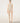 Wolford Infinite Rose Net String Body in cream, featuring a seamless sleeveless round neckline, sheer floral warp knit net, thong back, and cotton gusset with snap closure.