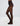 Model wearing Wolford Leo Net Tights in black showing animal-inspired pattern and matte finish