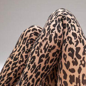 close-up of Wolford Leo Net Tights  in fairy light/black showing opaque spots on sheer fabric and fine knit detail