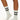 Model wearing Wolford Logo Ribbed Socks in white showing ribbed texture and blac logo detail around ankle