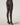 Back view of model wearing Mermaid Tights by Wolford with geometric scale pattern