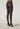 Back view of model wearing Mermaid Tights by Wolford with geometric scale pattern