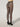 Back view of model wearing Wolford Net Tights in black showing waistband and overall net design