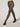 Model wearing Wolford Net Tights in black showing grid pattern and seamless construction
