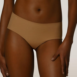 Front view of the Wolford Pure Panty in Fairly Light featuring a seamless invisible brief with a smooth stretch finish.