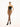 Black Wolford fishnet tights made from recycled ECONYL® yarn with matte finish and logo waistband for a sleek, sustainable look.