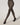 Model wearing Wolford Reptile Net Tights in Dark Wood showing fine fishnet pattern and matte finish