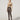 Model wearing Wolford Reptile Net Tights in Dark Wood showing fine fishnet pattern and matte finish