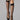 Model wearing Wolford Satin Touch 20 Knee-Highs in black showing sheer finish and comfort band