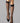 Model wearing Wolford Satin Touch 20 Knee-Highs in black showing sheer finish and comfort band