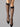 Model wearing Wolford Satin Touch 20 Knee-Highs in black showing sheer finish and comfort band