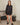 Aspen Dream black ribbed long sleeve top with relaxed fit and side slits in breathable, ultra-soft bamboo fabric.