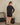 Aspen Dream black ribbed long sleeve top with relaxed fit and side slits in breathable, ultra-soft bamboo fabric.