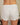 Aspen Dream ivory ribbed shorts with golden buttons and a pull-on waistband in breathable bamboo for stylish, everyday comfort.